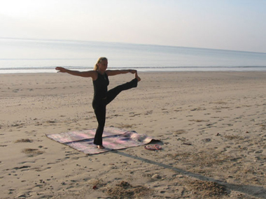 yoga pose on beach